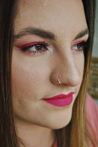 Close-up of beautiful young woman with make-up