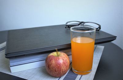 Close-up of orange juice in glass on table