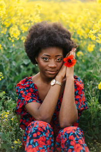 Positive beautiful afro girl on yellow field