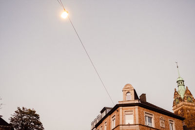 Low angle view of illuminated building against clear sky