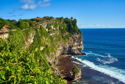 Scenic view of sea against blue sky