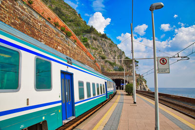 Train on railroad station platform against sky