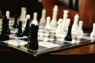 Close-up of chess game on table