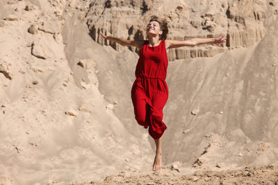 Full length of woman standing on ground