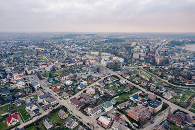 Scenic panoramic view of the lithuanian town in utena, lithuania in a peaceful misty cloudy day