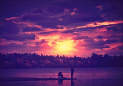 Scenic view of lake at sunset