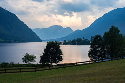 Scenic view of lake and mountains against sky