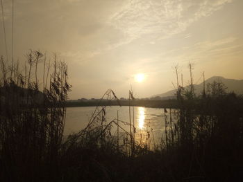 Scenic view of lake during sunset