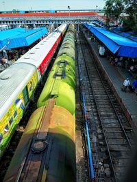 High angle view of train at railroad station against sky