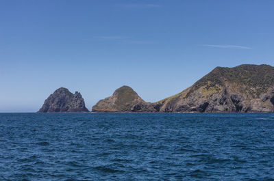 Scenic view of sea against clear blue sky