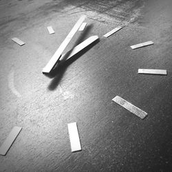 High angle view of arrow sign on table