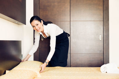 Portrait of a smiling young woman working