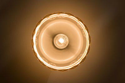 Low angle view of illuminated light bulb