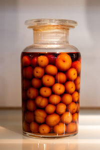 Close-up of eggs in glass container on table