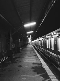 View of railroad station platform at night