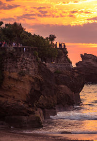 Scenic view of rock formations against sky during sunset