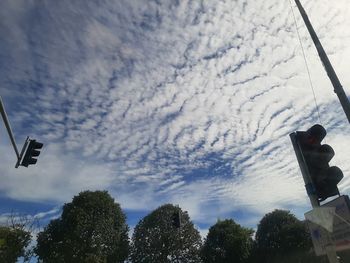 Low angle view of street light against sky