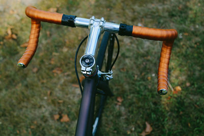 Close-up of bicycle on grass
