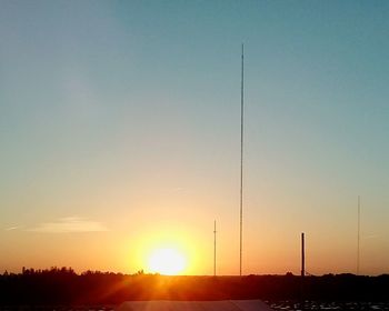 Silhouette of windmill against sky during sunset