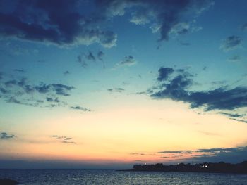 Scenic view of sea against sky at sunset