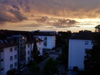 High angle view of buildings against sky at sunset