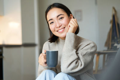 Young woman using mobile phone