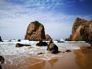 Rock formations on shore at beach