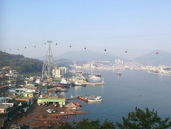 High angle view of suspension bridge over sea against sky