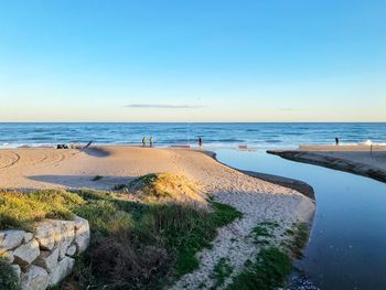 Scenic view of sea against clear blue sky