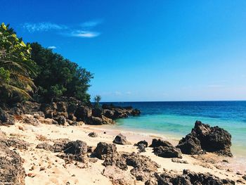 Scenic view of sea against clear blue sky