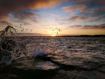 Scenic view of sea against sky during sunset