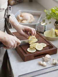 Woman slicing lemon