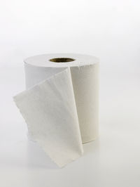 Close-up of toilet paper against white background