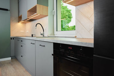 Modern kitchen interior with cabinets and empty countertop