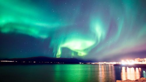 Scenic view of sea against sky at night