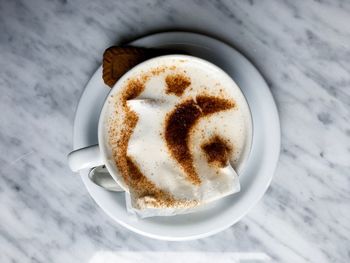 High angle view of cappuccino on table