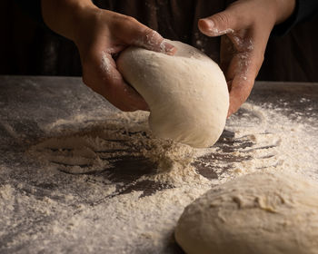 Midsection of person preparing food on table