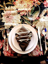 High angle view of various flowers in plate on table