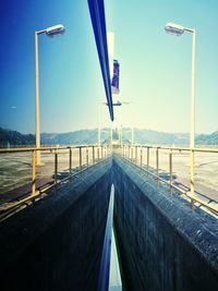 View of empty road along calm sea