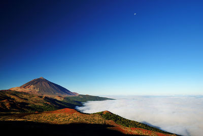 Scenic view of el teide volcano against blue sky