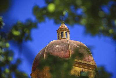 Low angle view of statue against sky