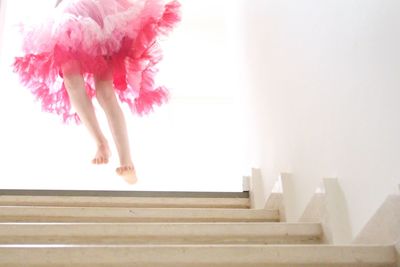 Low section of woman on staircase