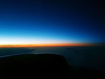 Scenic view of silhouette landscape against clear sky during sunset