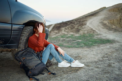 Man sitting on road