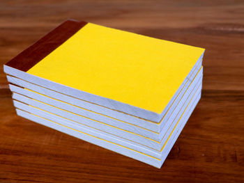 High angle view of yellow paper on table