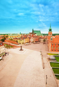 Buildings in town against sky