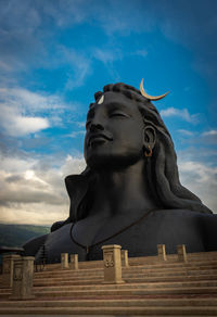 Low angle view of statue against sky