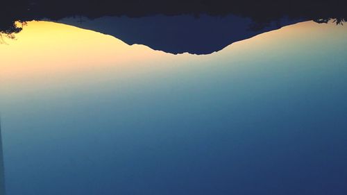 Scenic view of silhouette mountain against sky during sunset