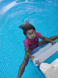 High angle view of girl in swimming pool