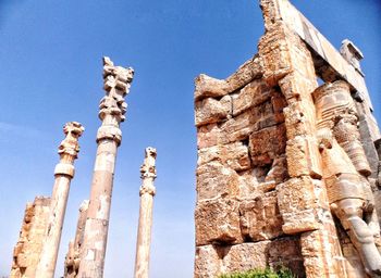 Low angle view of statue against sky